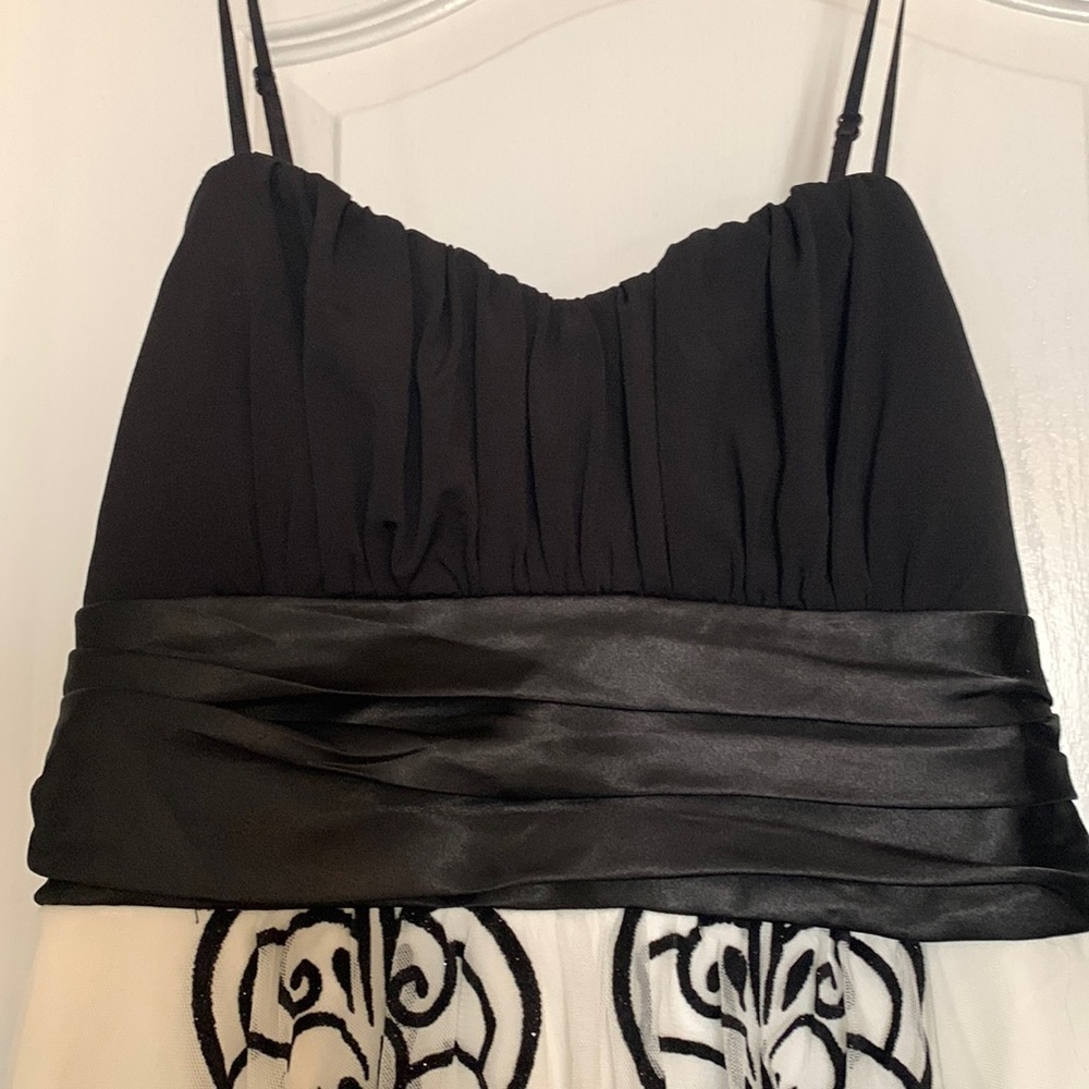 Triixxi Tween dressโฆblack bodice with white and black applicques